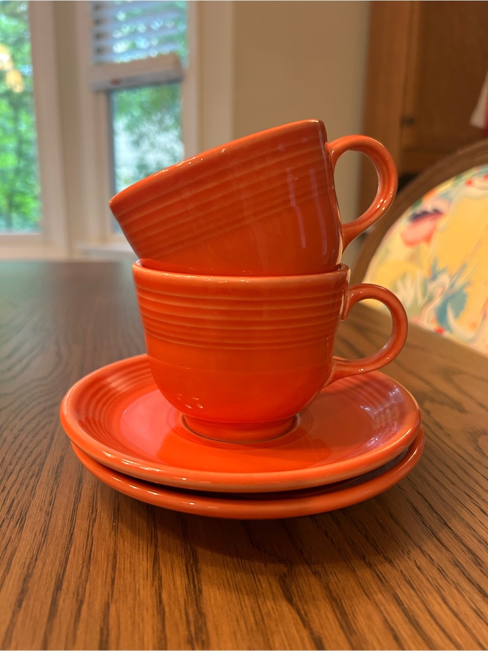 Fiestaware Persimmon Retired teacups and saucers (2)